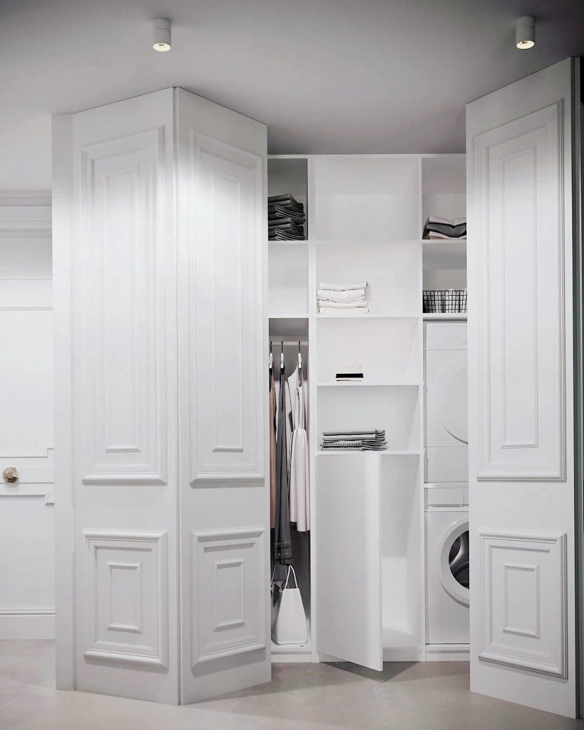White paneled cabinetry doors open to reveal a built-in laundry and storage wall system.