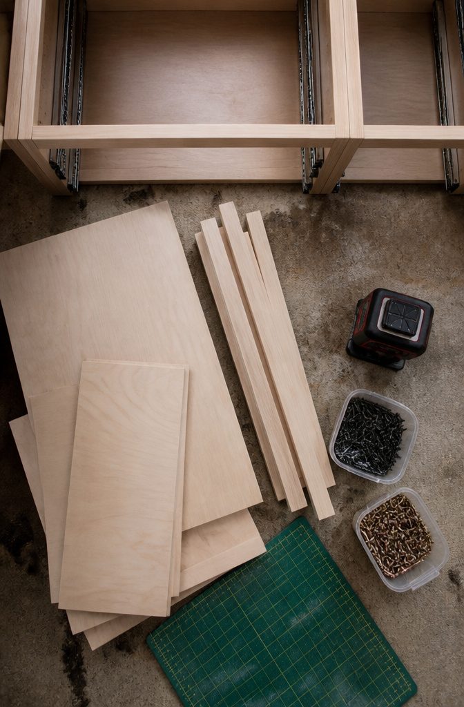 Pullout Drawers in Cabinet: Types, Costs, and Installation Guide 11 Materials needed for installing pullout drawers are displayed on a table.